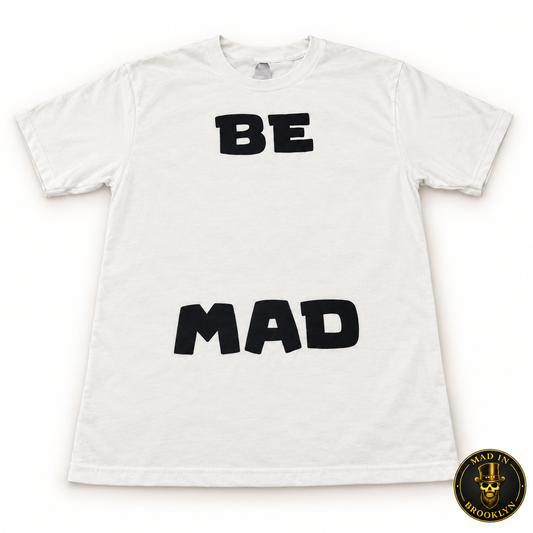 White unisex T-shirt with black BE MAD lettering