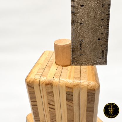 Wooden hat block spinner top peg shown beside ruler