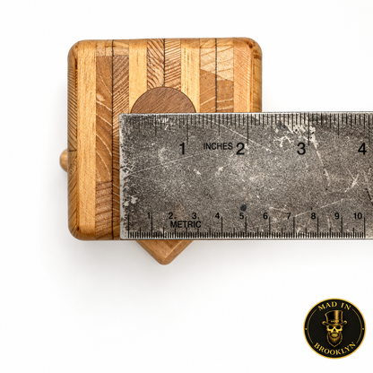 Wooden hat block spinner shown beside ruler for width